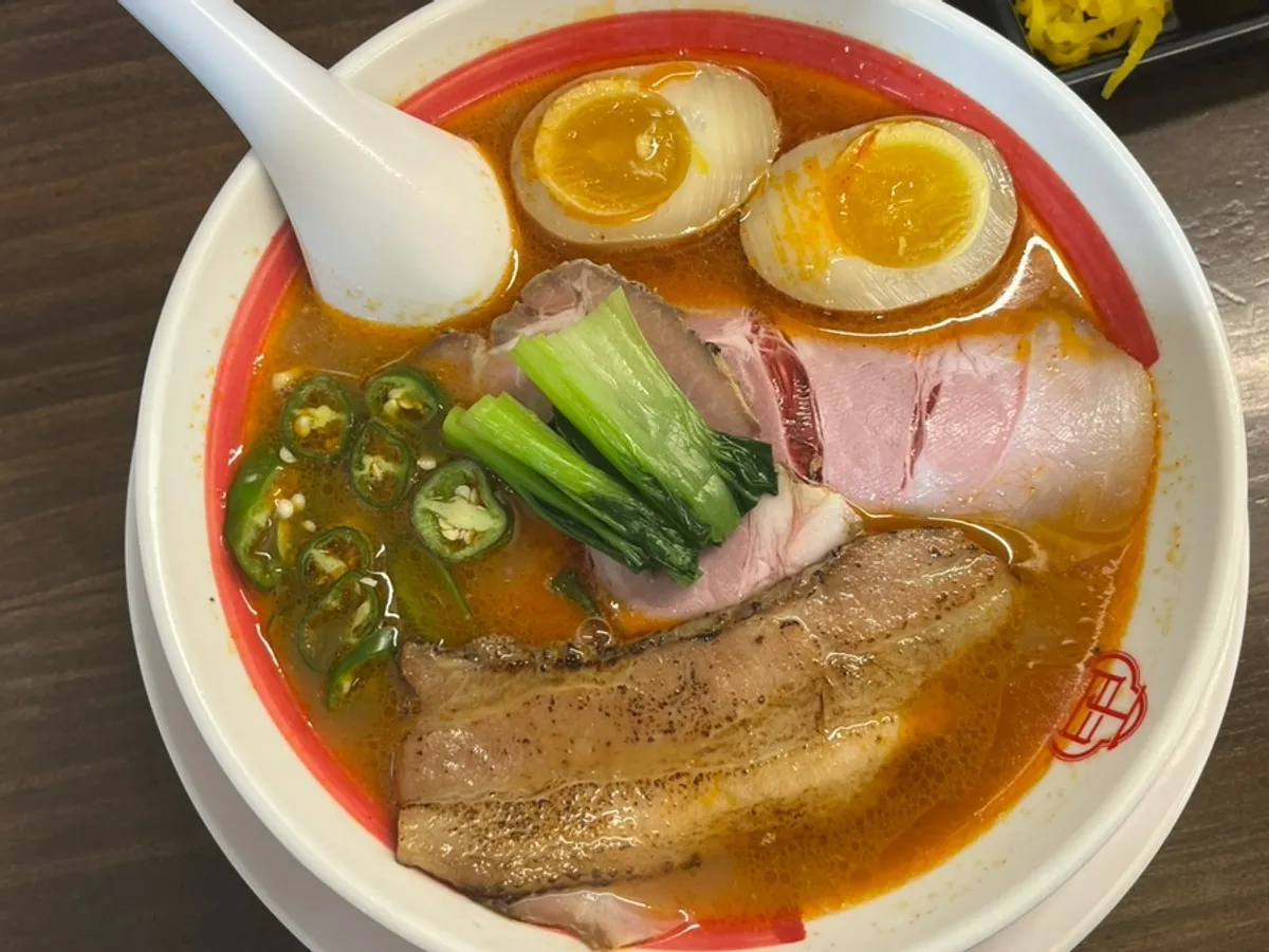 Spicy ramen topped with egg and chashu