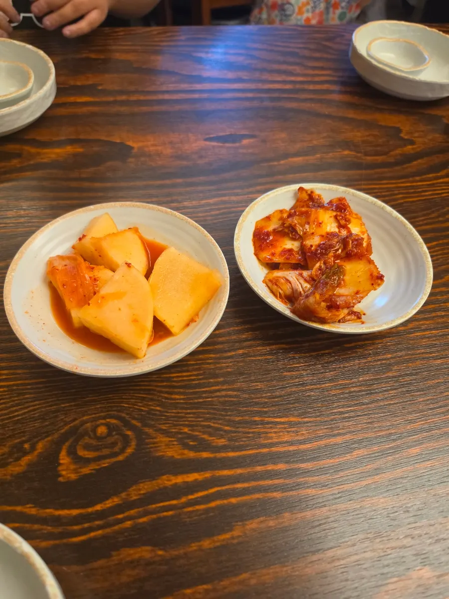 Self-serve corner with kimchi and plastic gloves