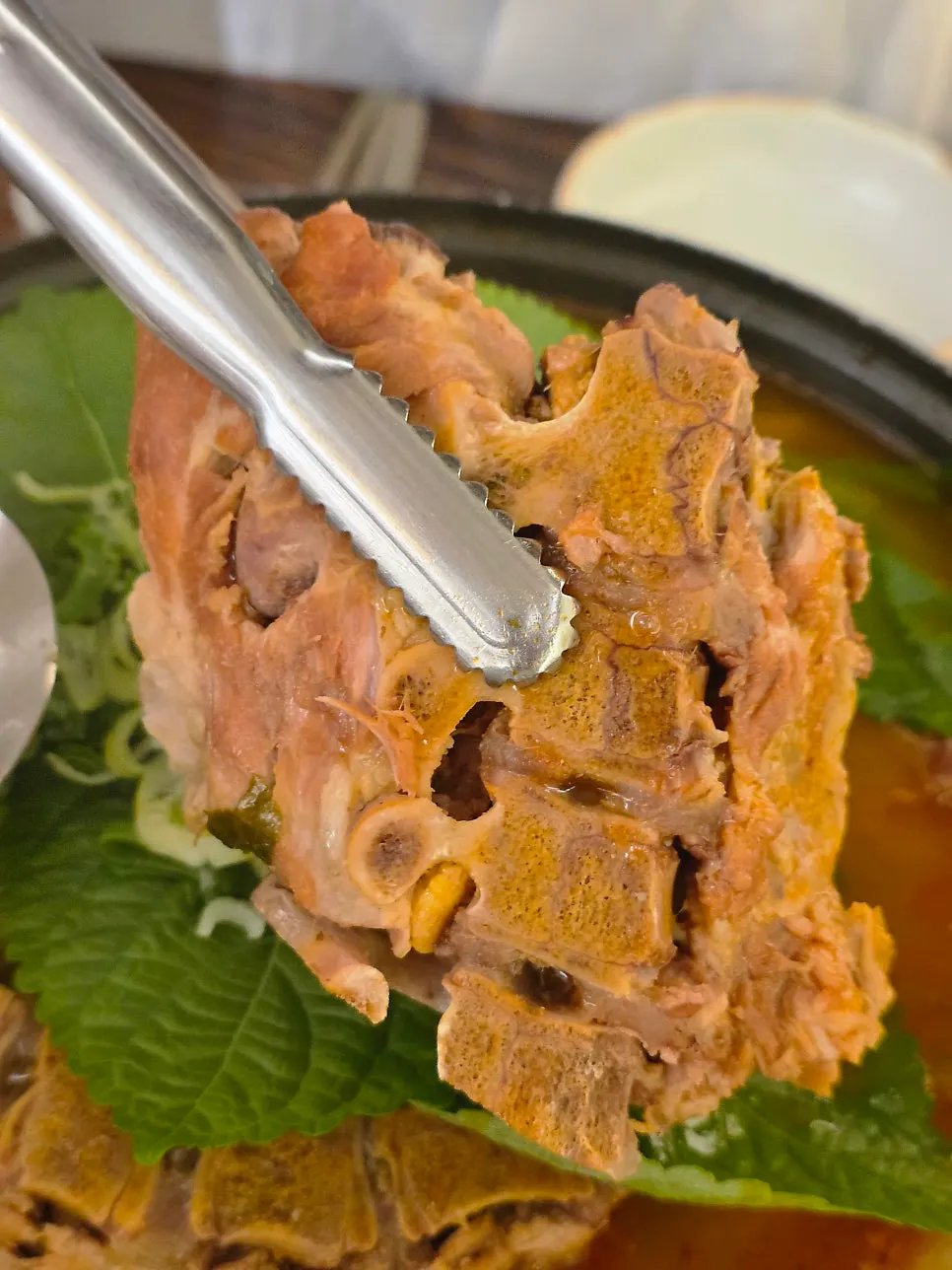 Gamjatang submerged with potatoes, meat and dried radish greens