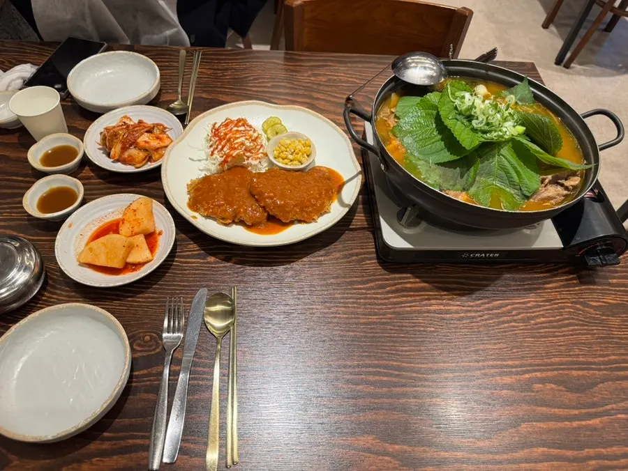 Hand-breaded pork cutlet served alongside the gamjatang
