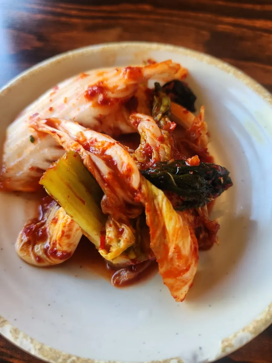 Plate of house-made diced radish kimchi at Chomu Gamjatang