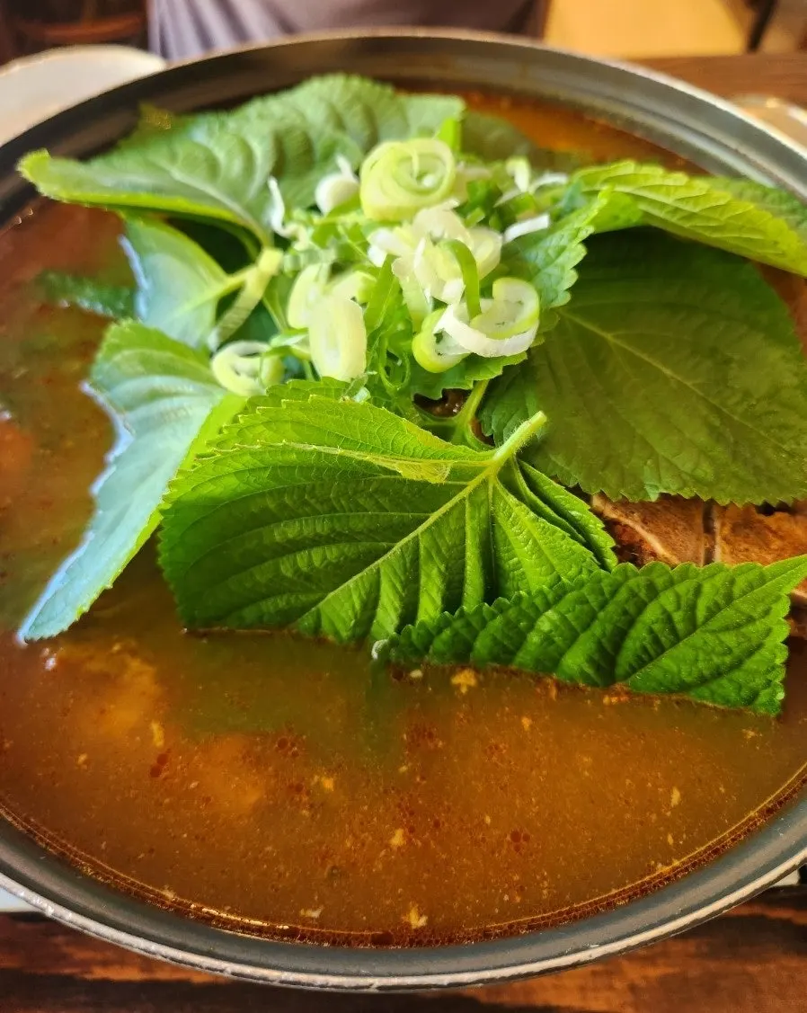Pot of small gamjatang packed with meat and napa cabbage