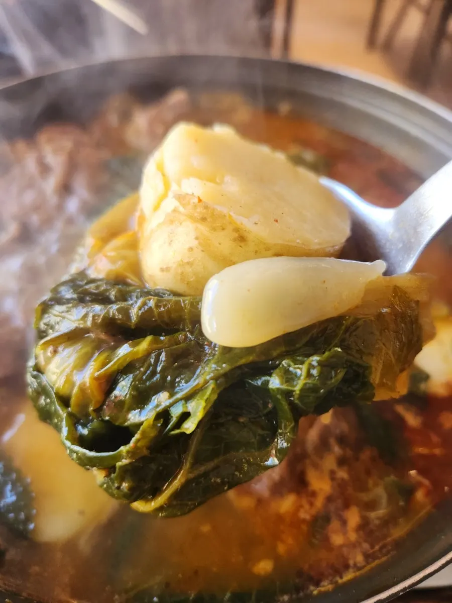 Spoonful of gamjatang broth once fully developed