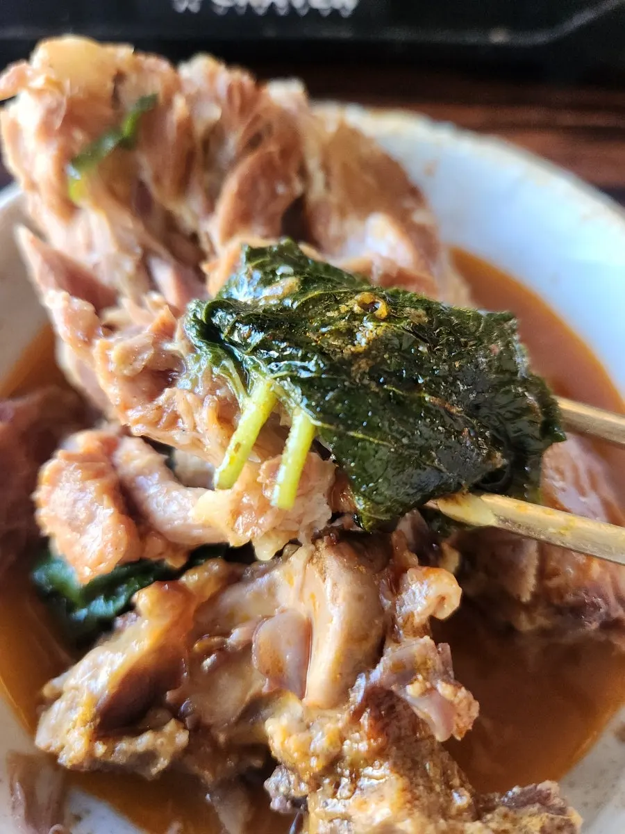 A piece of gamjatang meat placed on rice