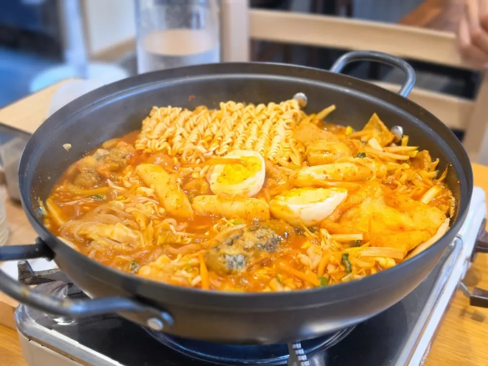 A generous topping spread for a single serving of instant tteokbokki