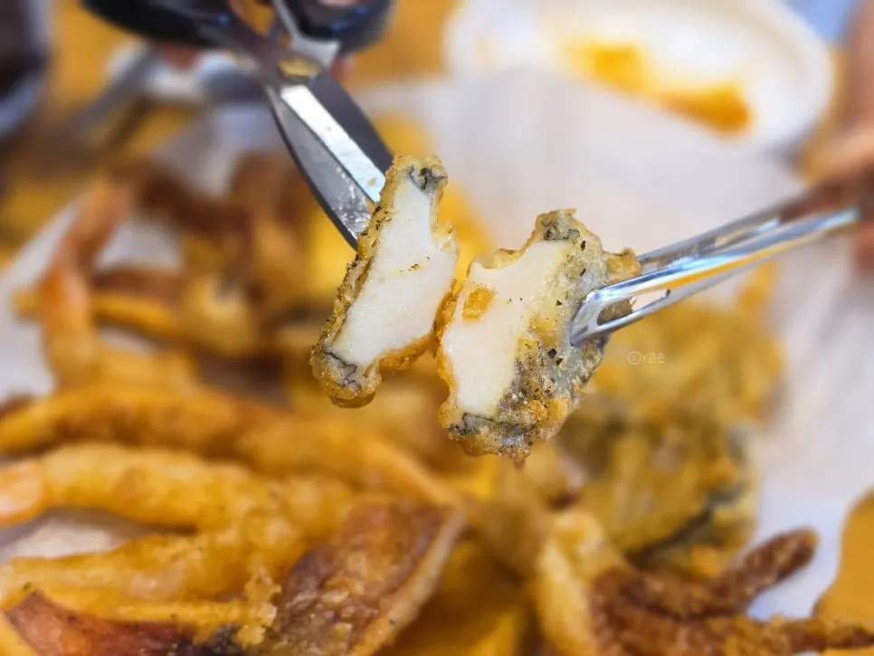 Picking up a piece of squid tempura