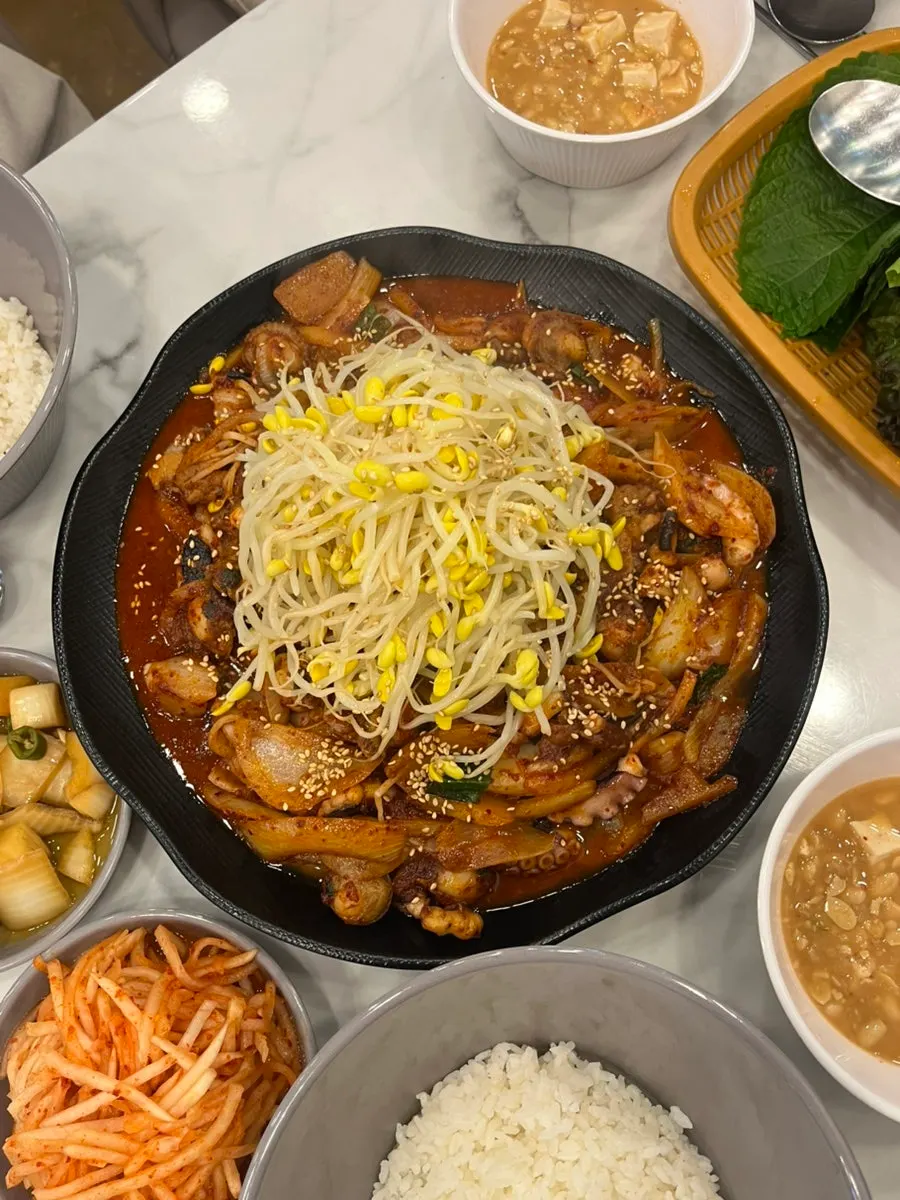 Menu listing octopus hot pot and soy-marinated pork belly