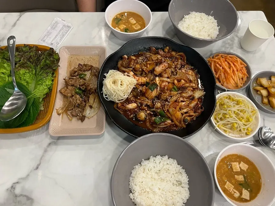 Full table spread of octopus stir-fry