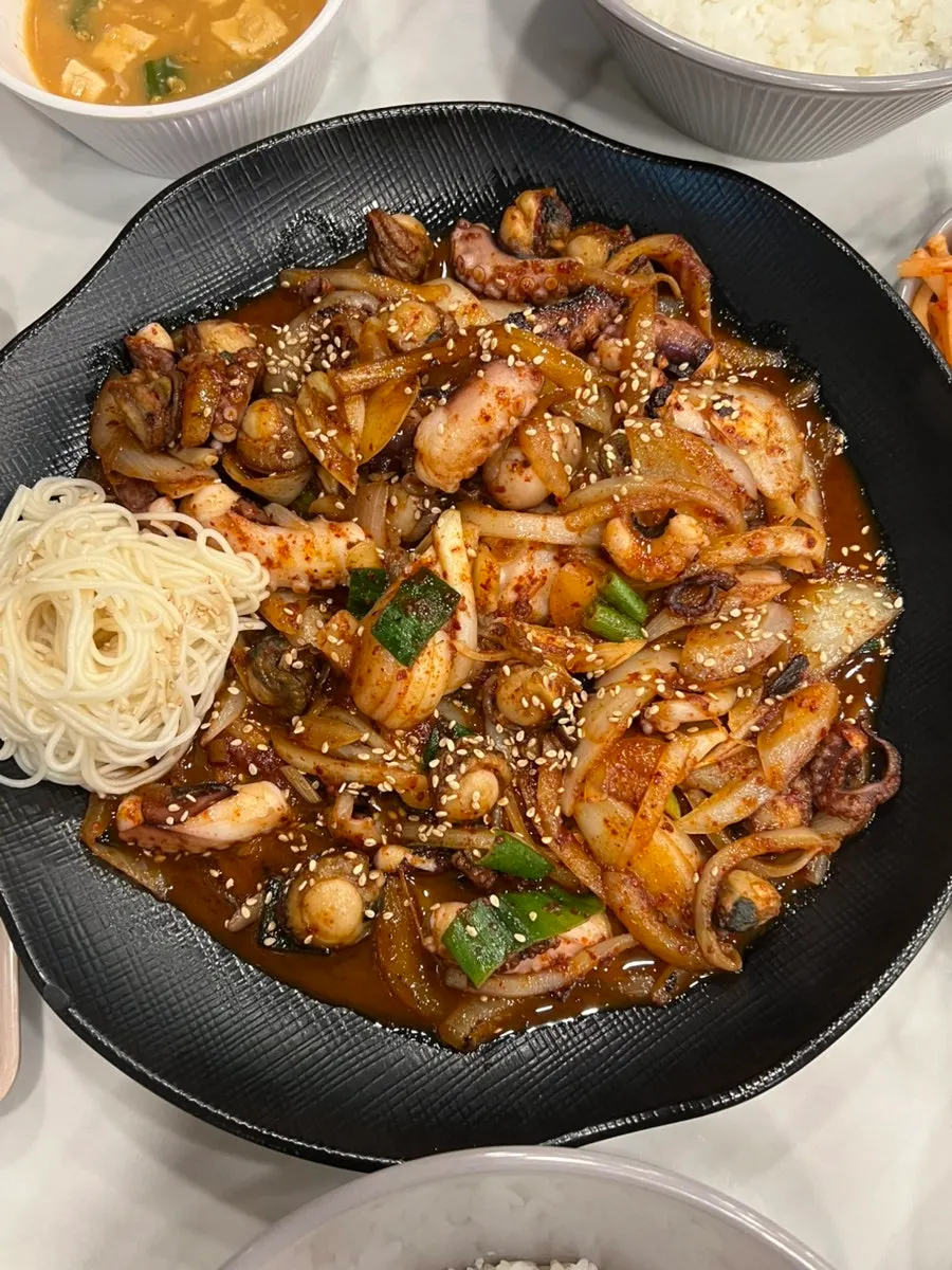 Scallop octopus stir-fry topped with noodles