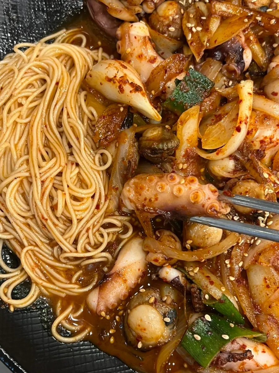 Eating the octopus stir-fry with rice