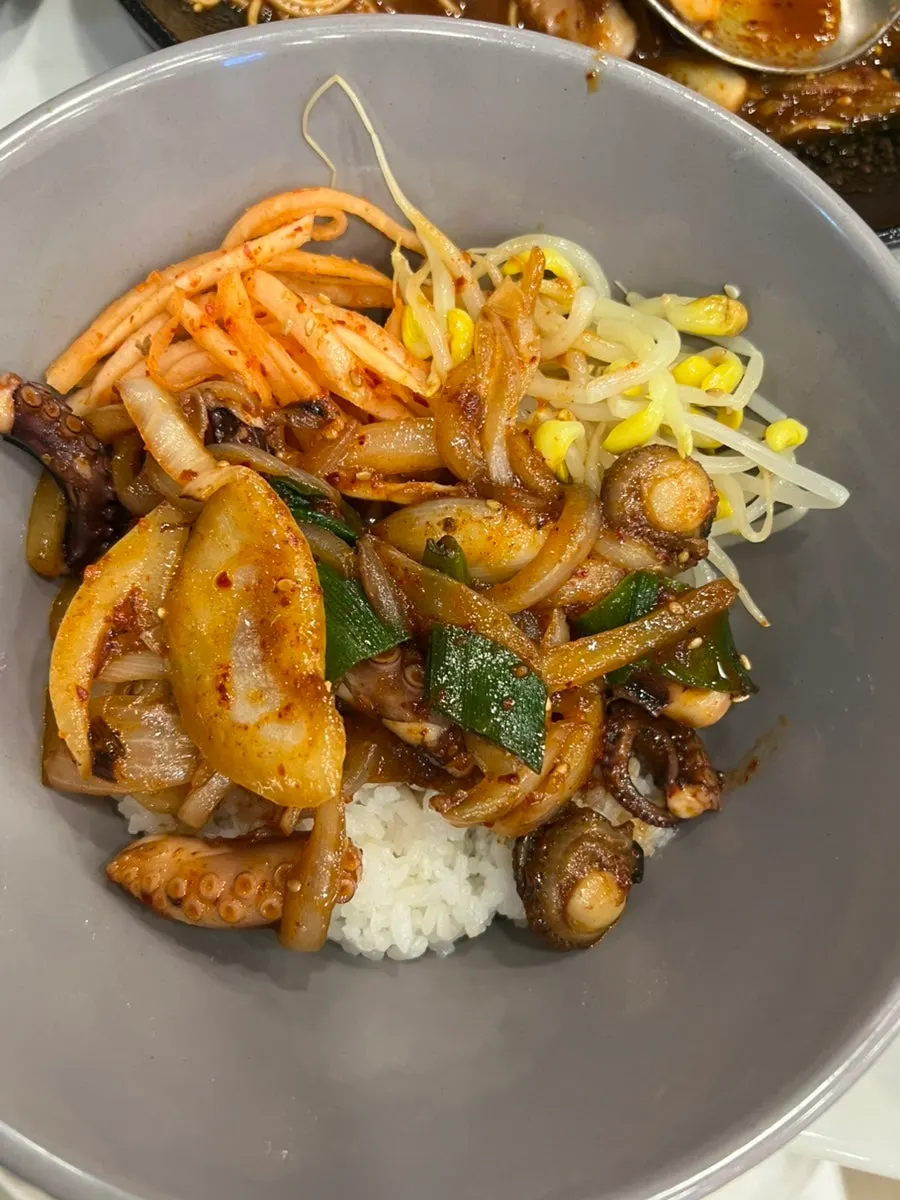 Octopus stir-fry eaten in a lettuce wrap