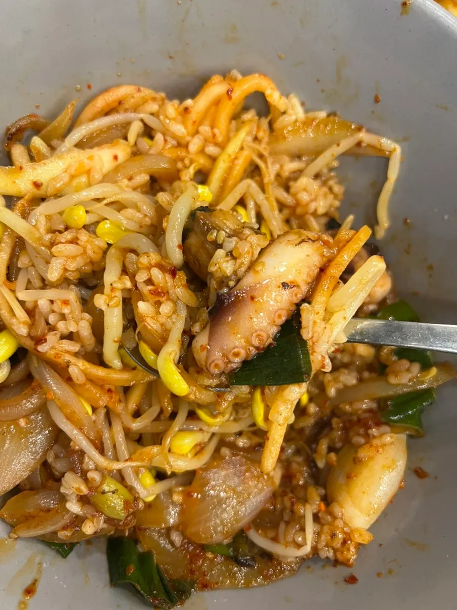 Rice mixed with vegetables and octopus stir-fry