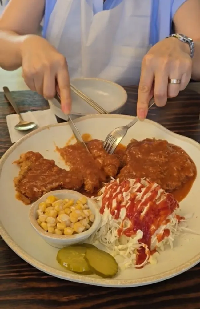 Vertical shot of gamjatang and pork cutlet