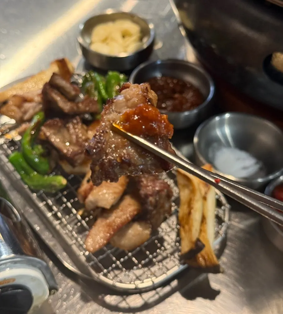 Fresh ribs and special cuts turning golden as they cook