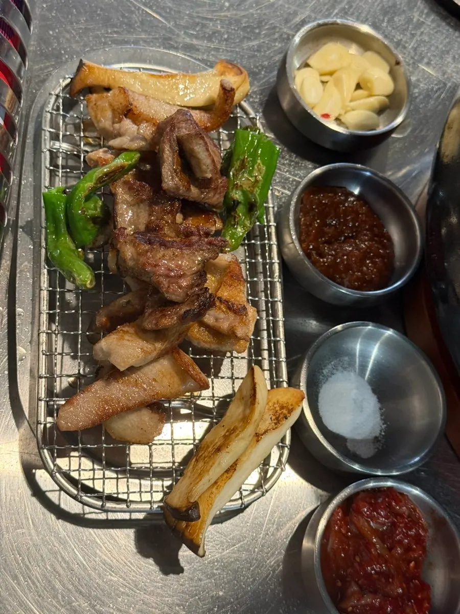 Cooked meat placed on a dedicated resting rack