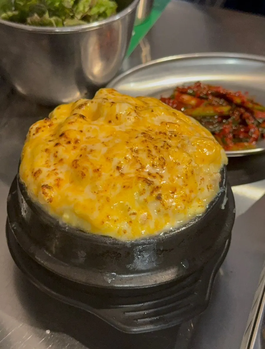 Cheese-topped egg custard in an earthenware pot