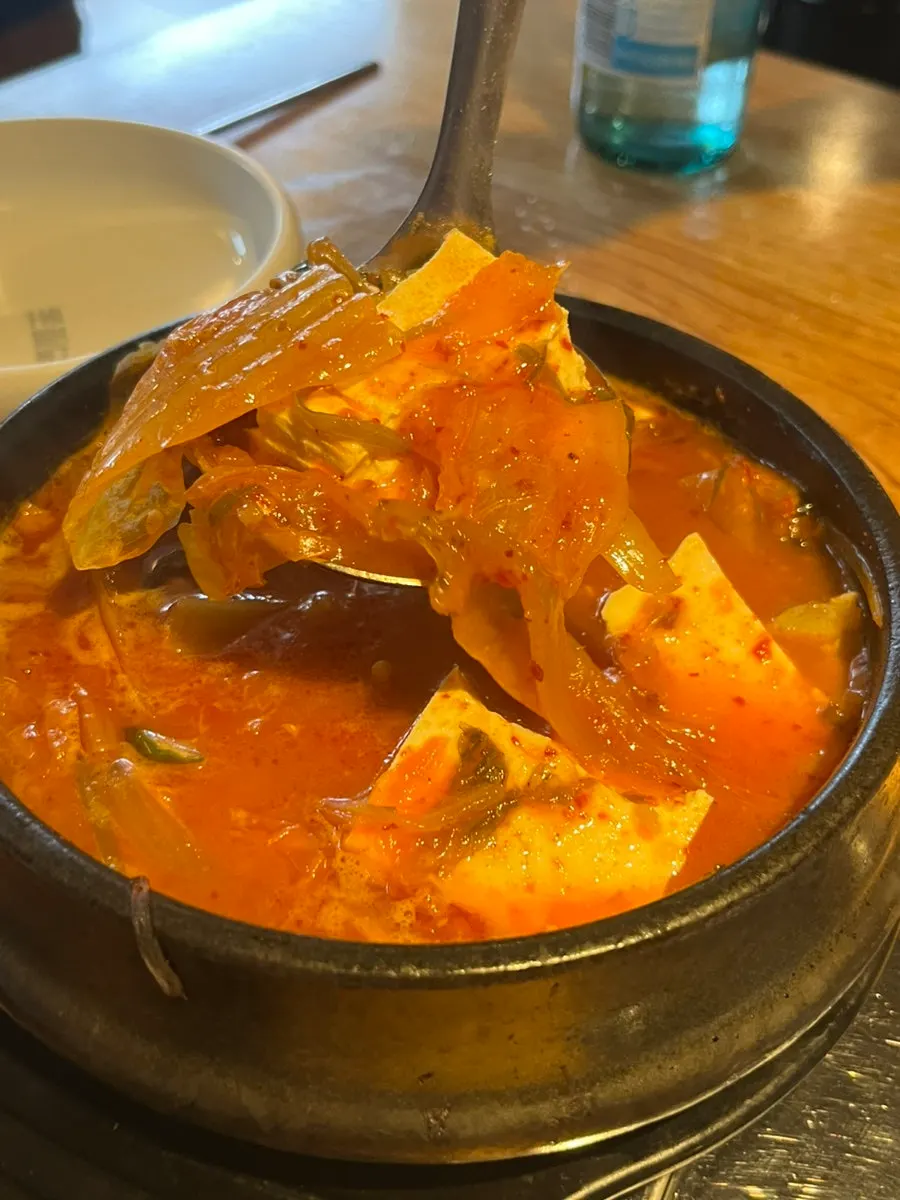 Grilled ogyeopsal served with side dishes