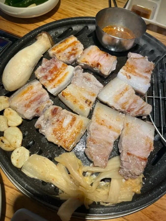 Kimchi jjigae broth with whole pork pieces
