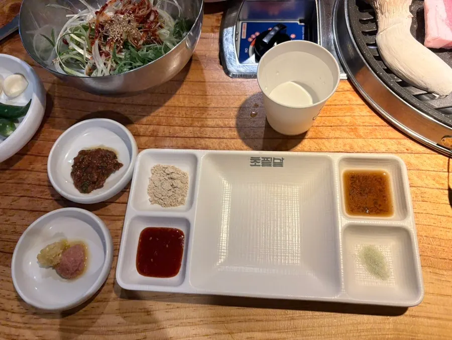 Various sauces in a plate that doubles as a personal dish