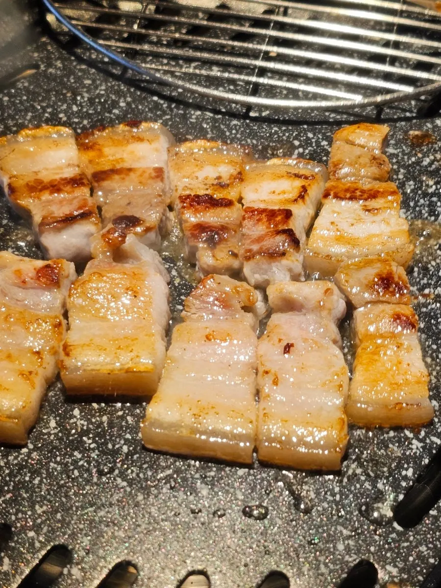 Grilled pork belly with the skin still attached