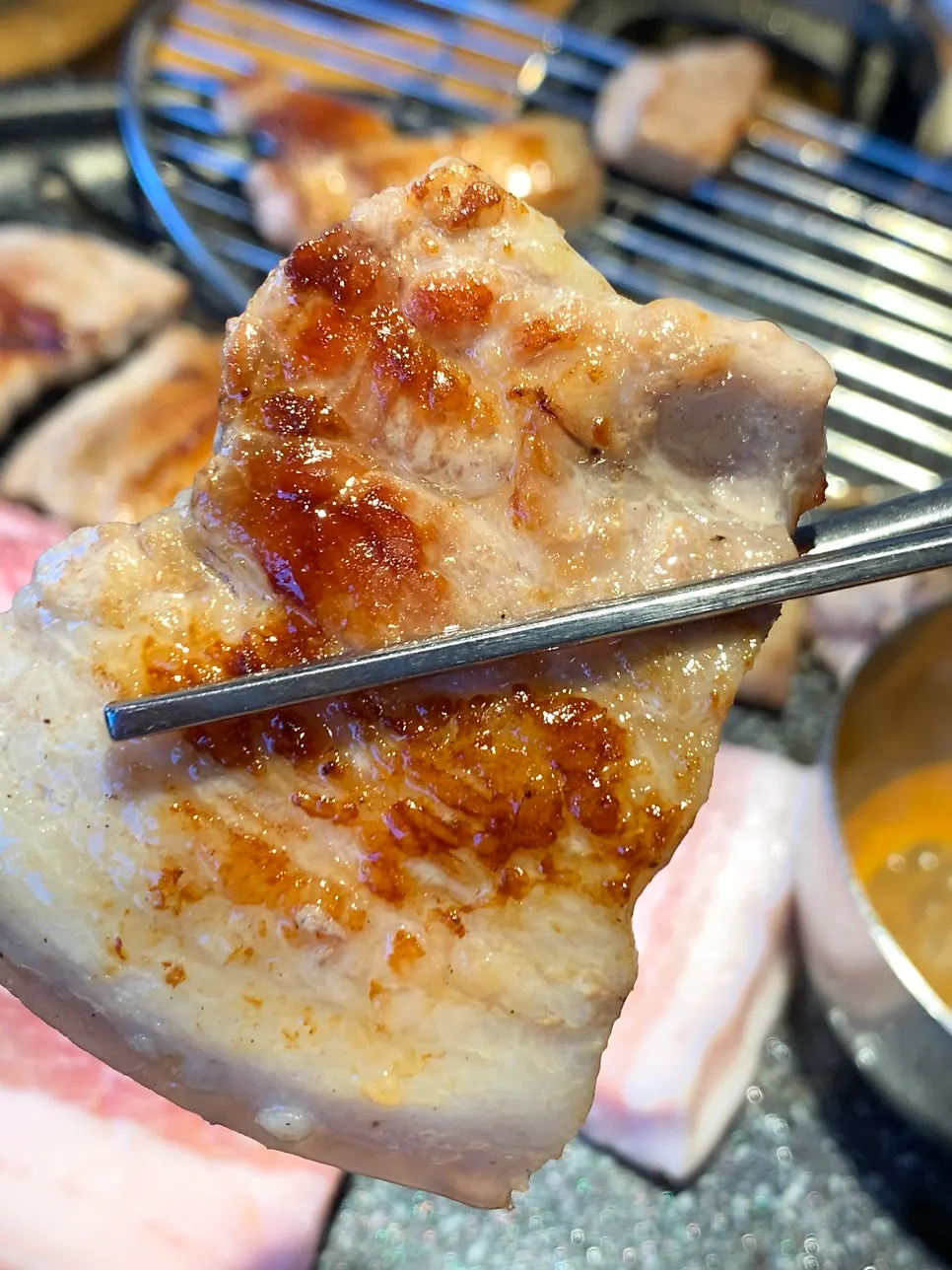 A generous spread of pork belly and side dishes