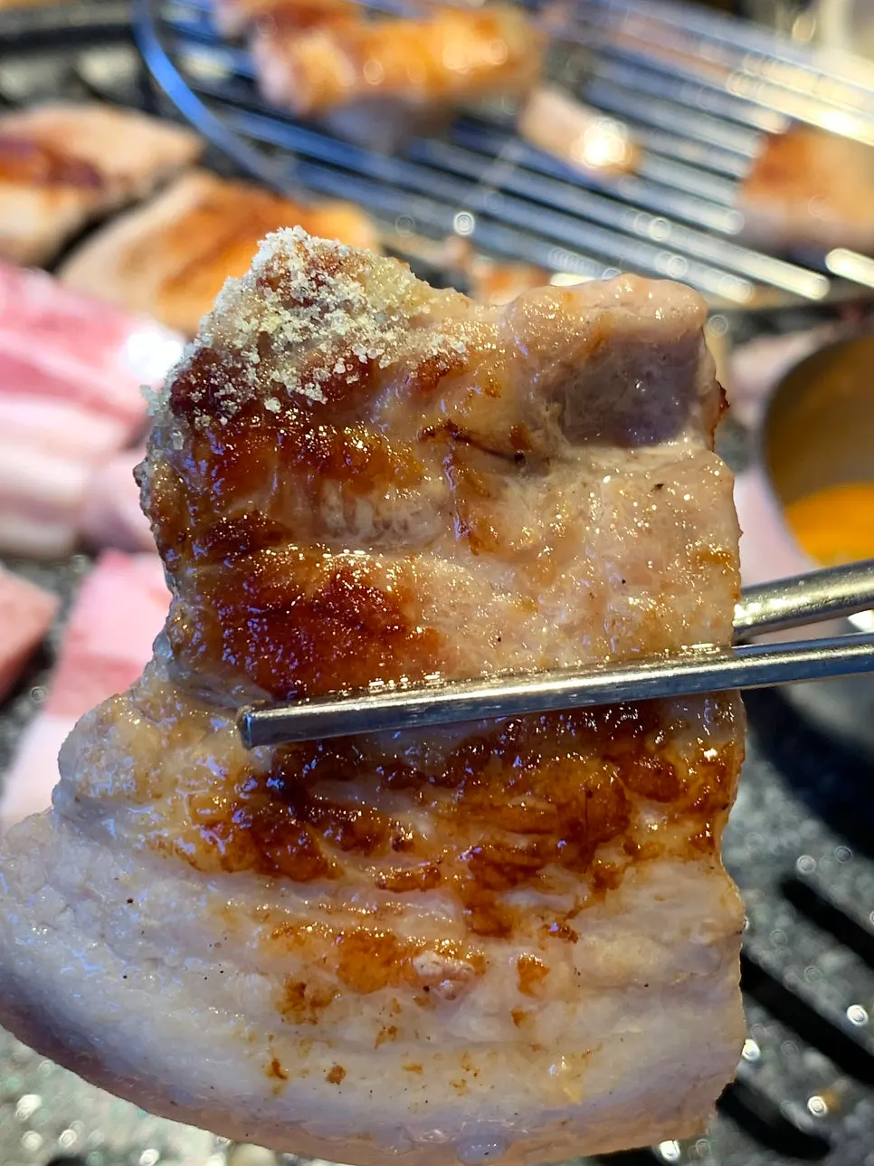 Salted pork belly grilling on the tabletop grill