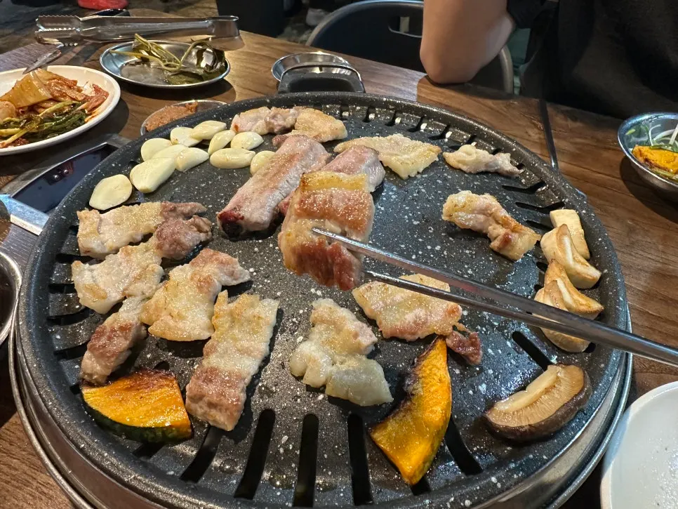 A plate combining raw pork ribs and side dishes