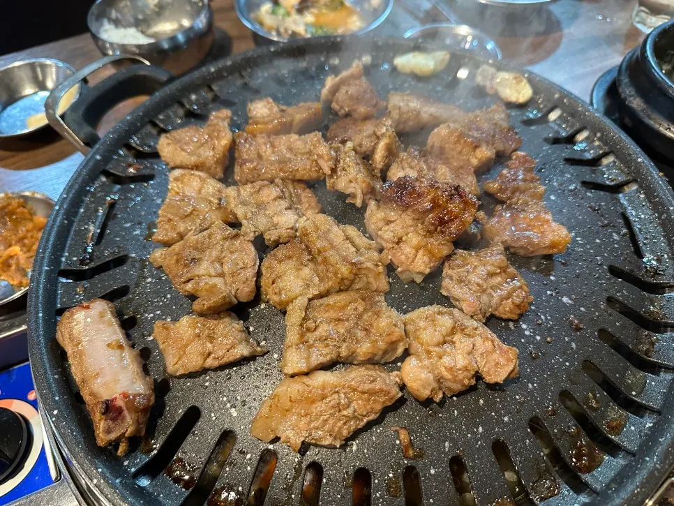 Seasoned pork ribs grilling on the tabletop grill