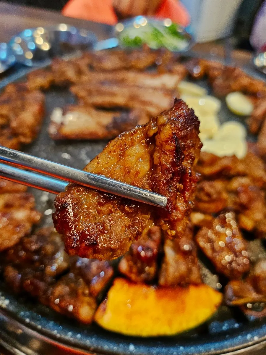 Marinated galbi turning golden brown at Choryang Hyeongje Galbi