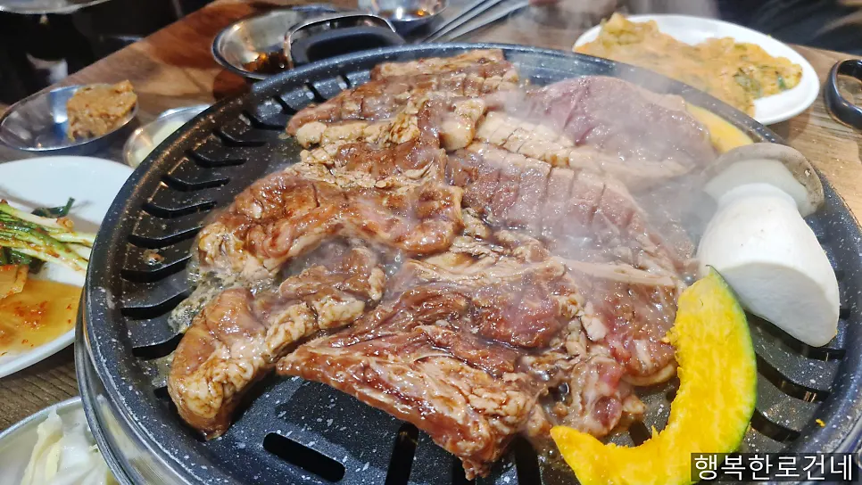 Grilling the marinated ribs at Choryang Hyeongje Galbi