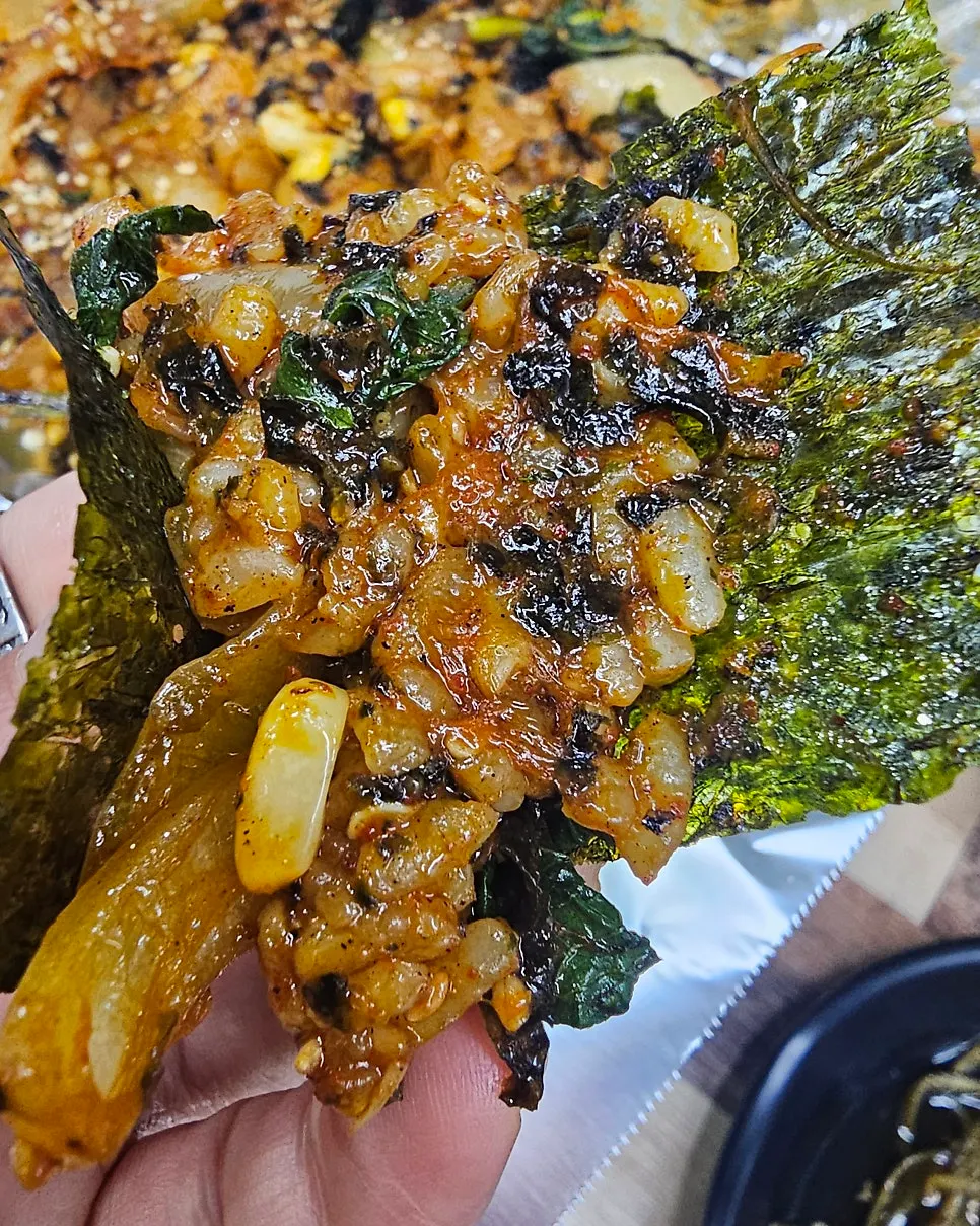 A spoonful of fried rice with corn kernels
