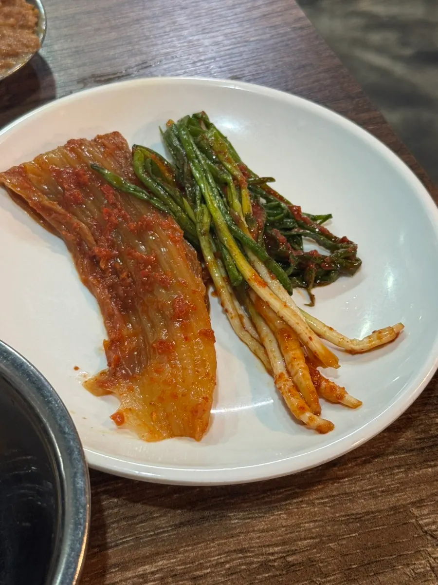Garlic, ssamjang, and pan-fried jijim side dishes