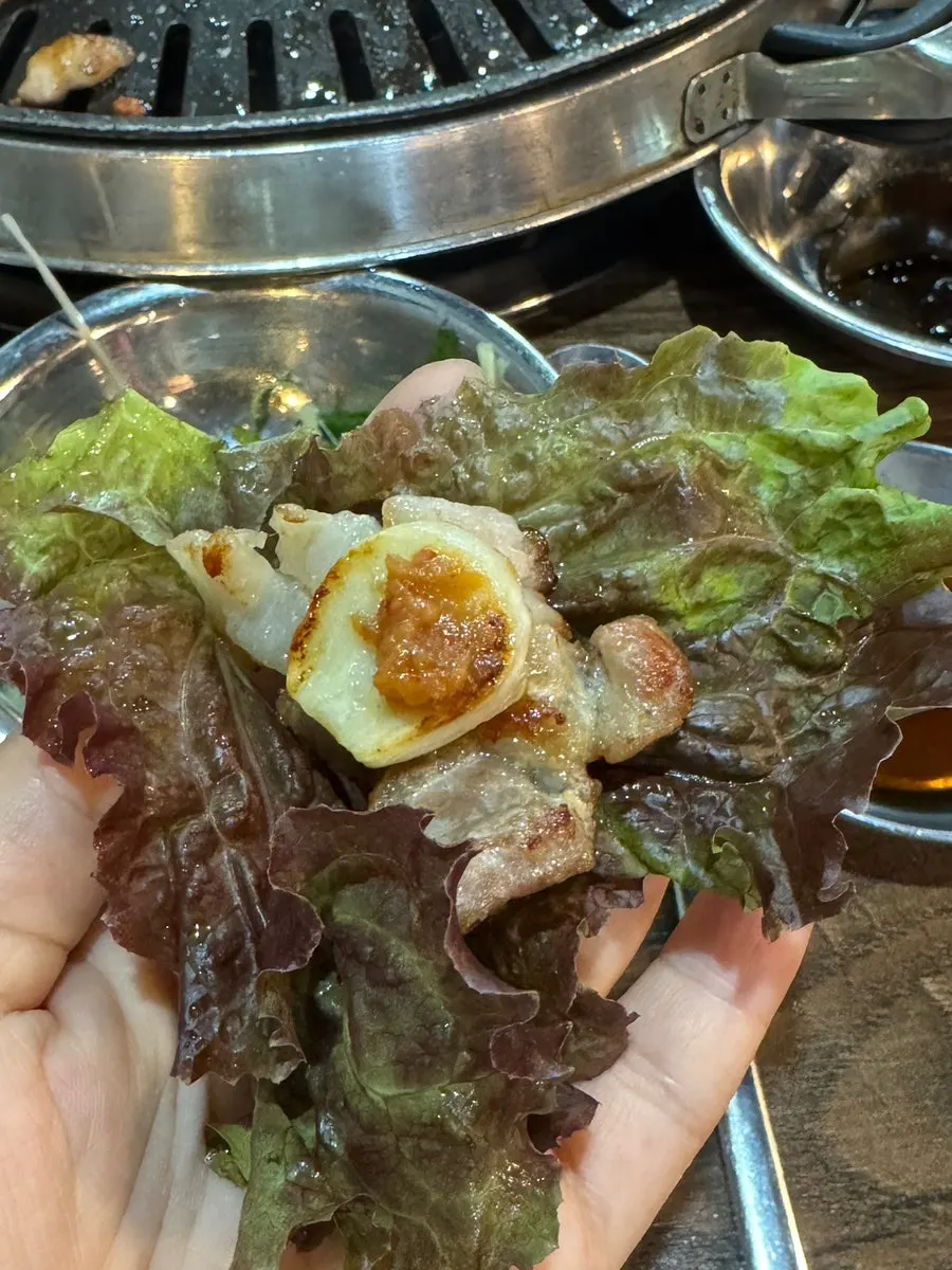 Meat paired with scallion kimchi and aged kimchi
