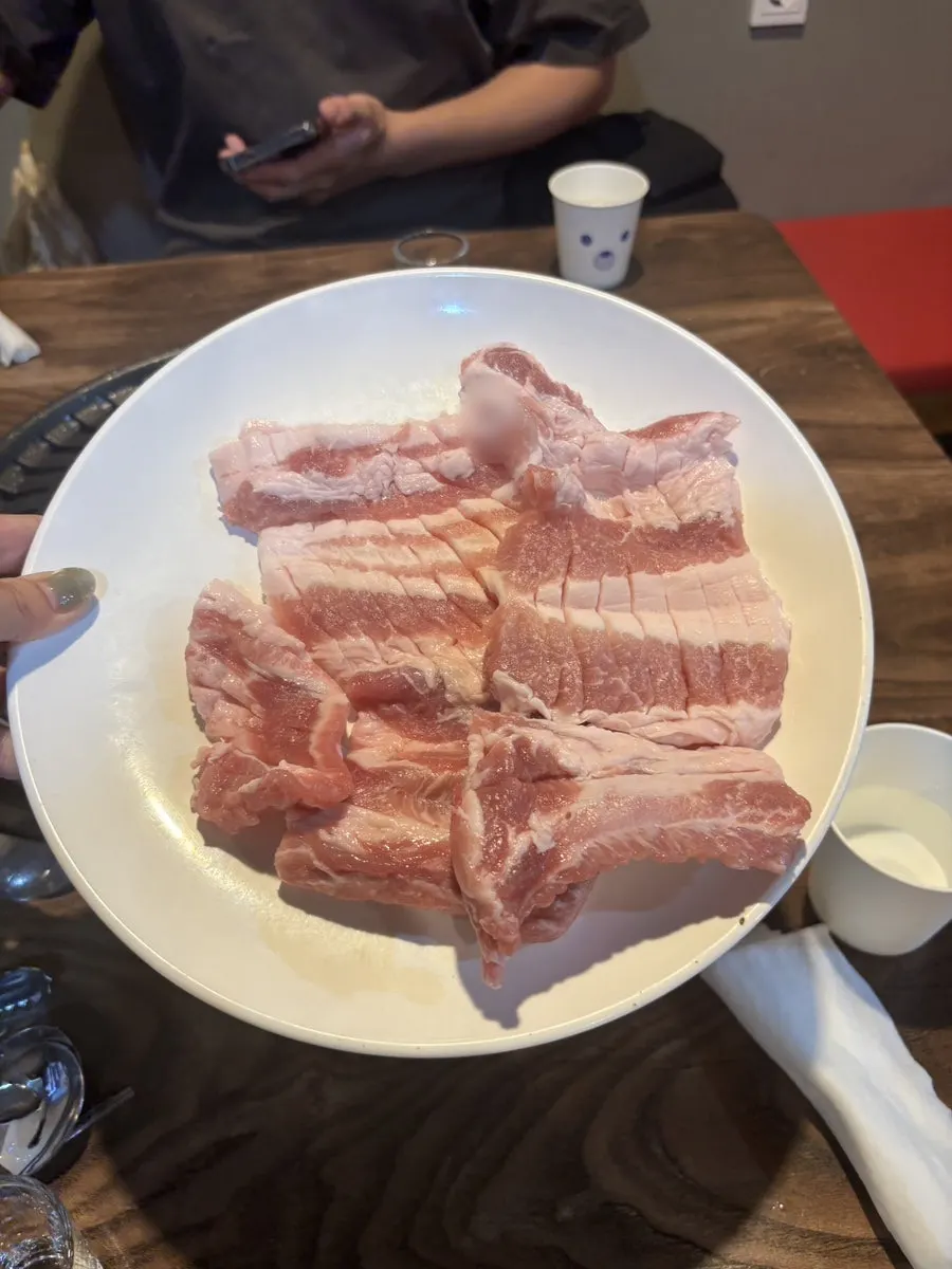 Menu board showing Choryang Hyeongje Galbi's raw and marinated ribs