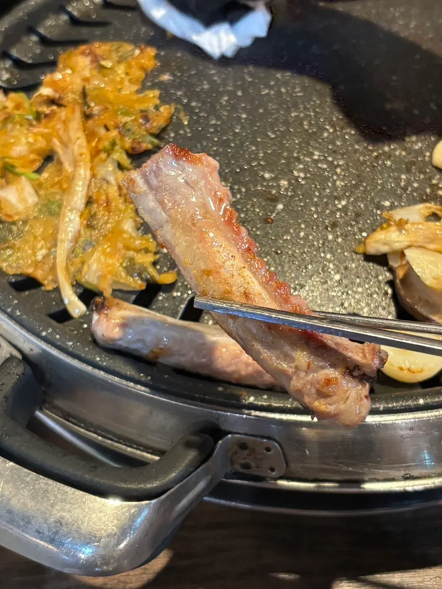 Eating raw pork ribs off the bone