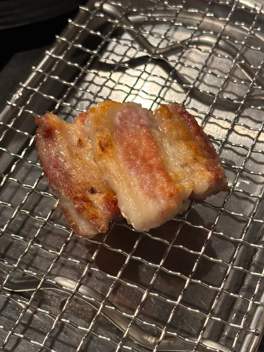 Staff member grilling fresh ribs on the plate