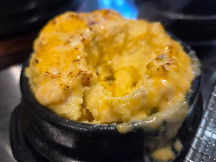 A spoonful scooped from the cheese egg custard