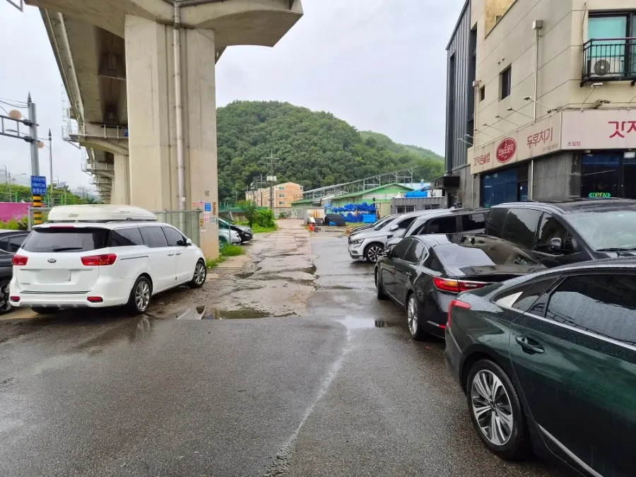 Building exterior with parking space out front