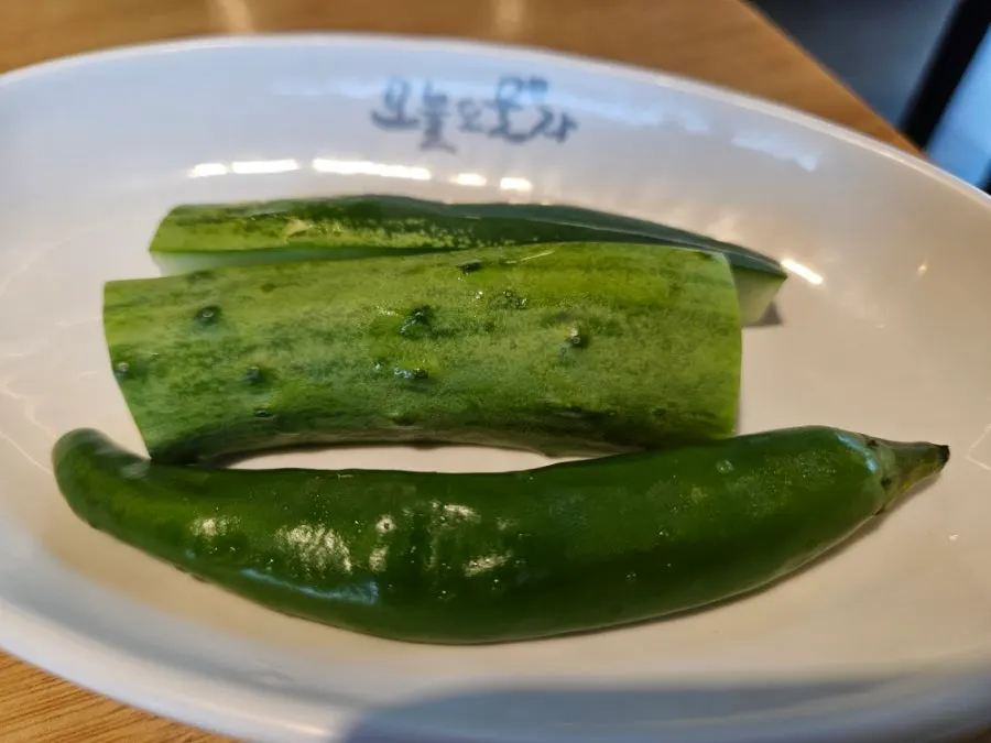 Cucumber, onion, and dried shredded radish side dishes