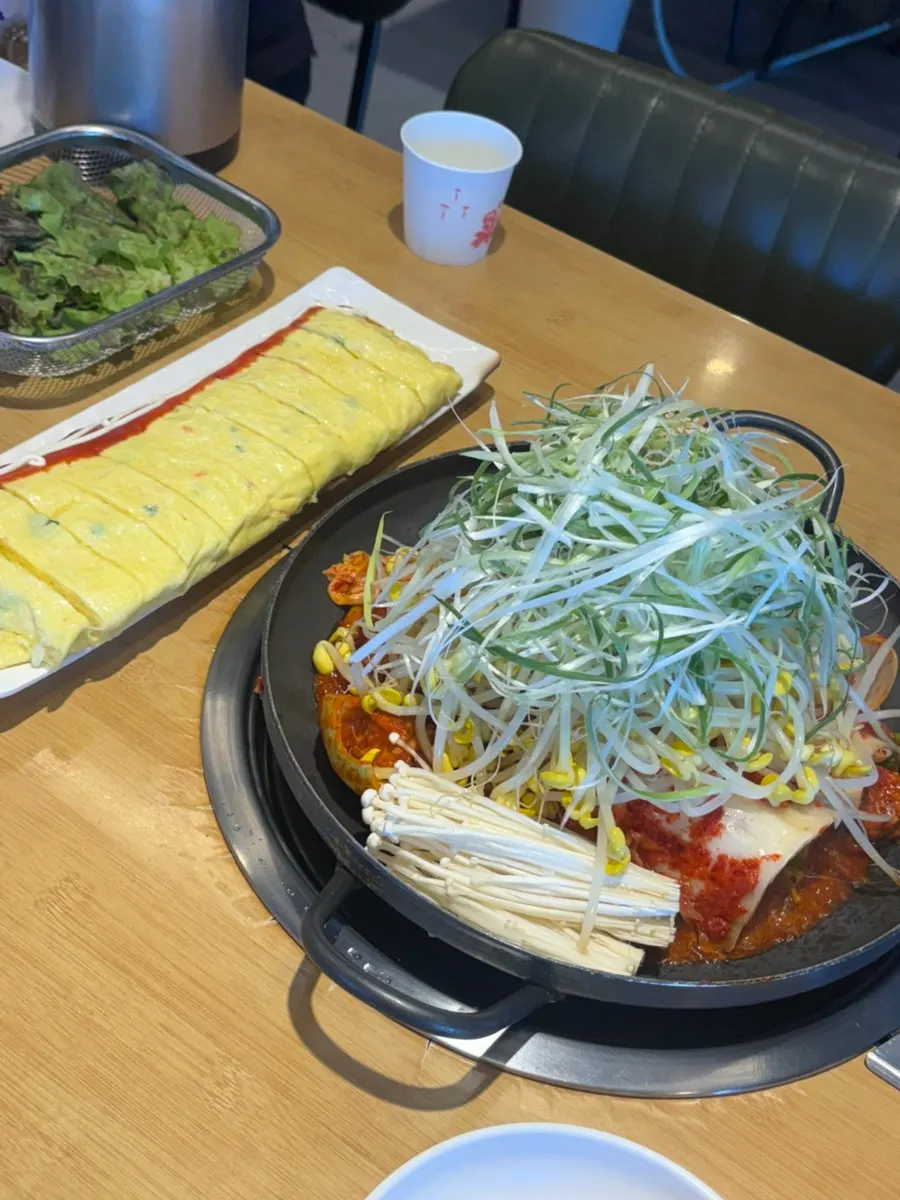 Large rolled omelet filled with cheese