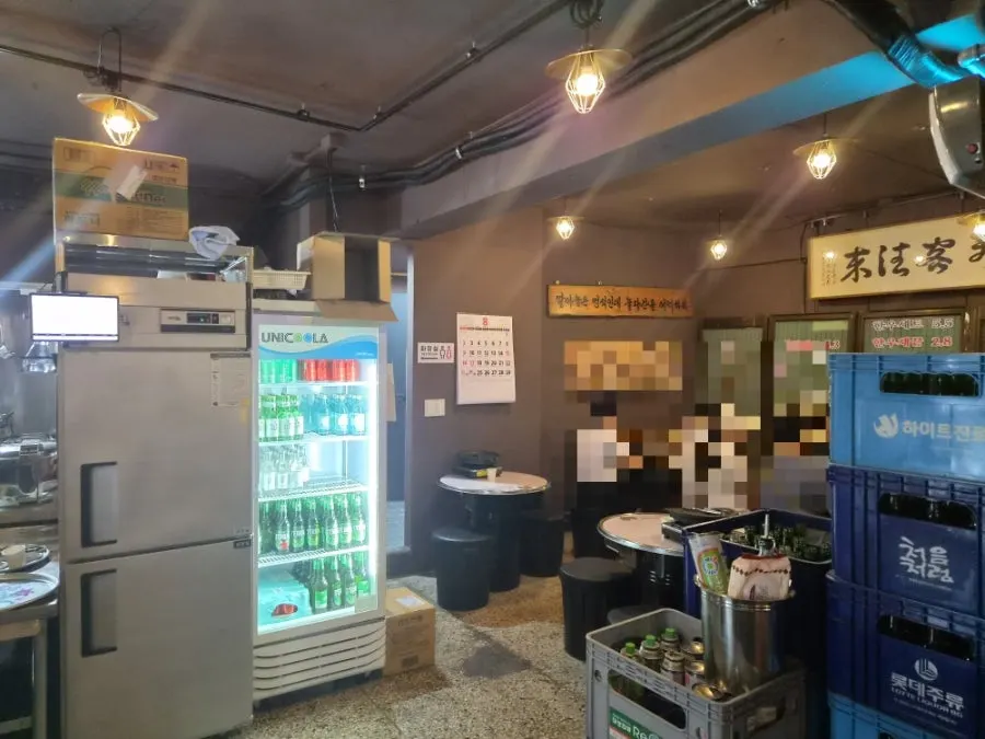A cozy table and grill at Chowon