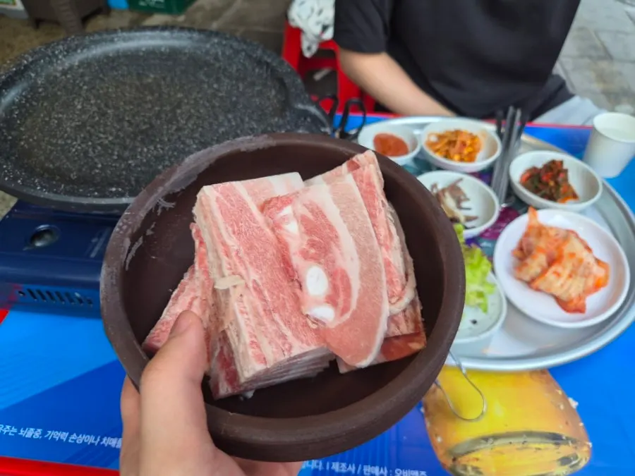 Chowon's pork belly sizzling on the grill