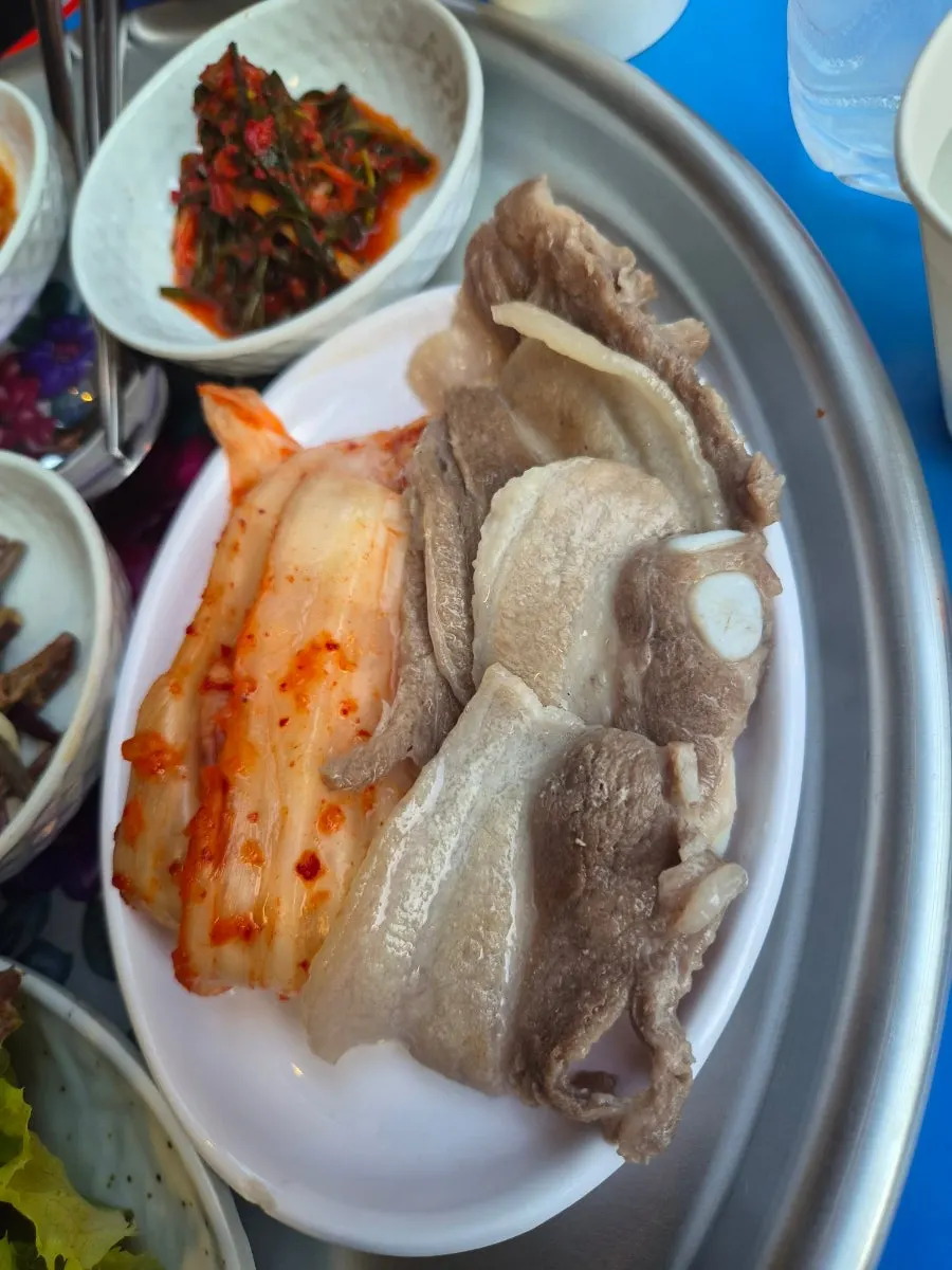 A table with pork belly and a round of drinks