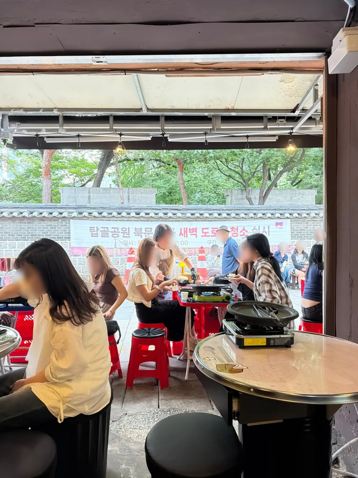 Outdoor tent tables and storefront at Chowon Restaurant Jongno 3-ga Branch