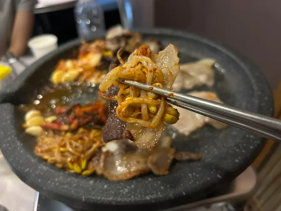 A golden-brown piece of grilled pork belly