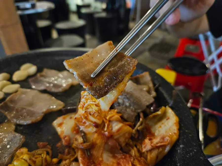 Frozen pork belly enjoyed with an assortment of toppings