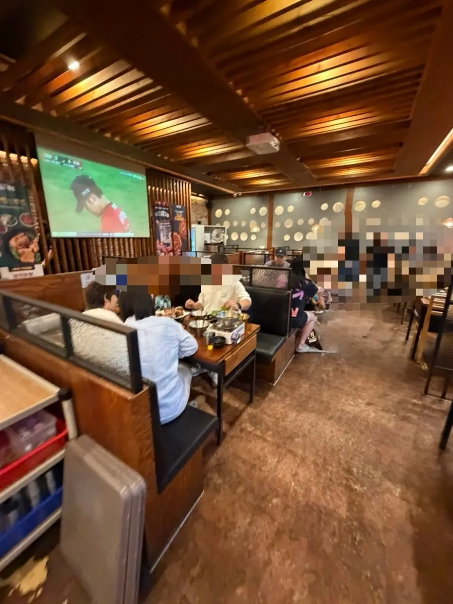 Big screen showing a baseball broadcast in the restaurant