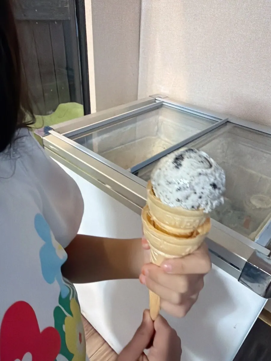 Dessert corner with ice cream, coffee, and a game machine