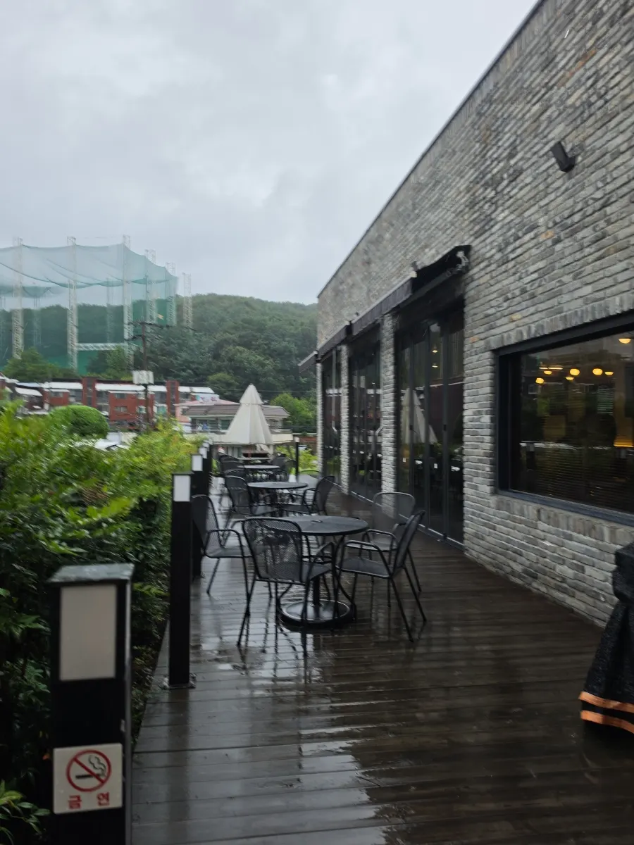 Outdoor terrace seating set up beside the entrance