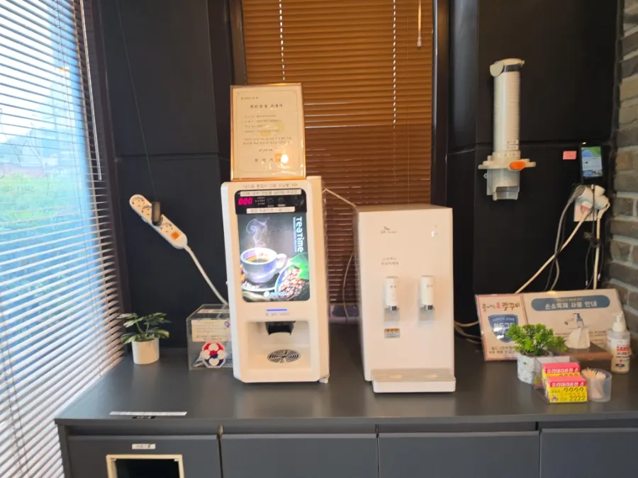 Milk coffee and water dispenser corner in front of the counter